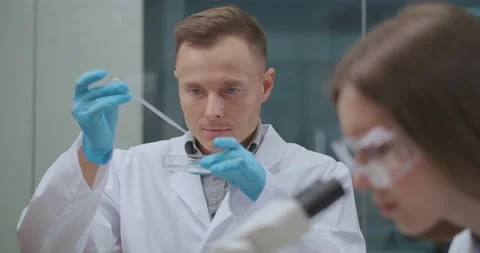 Two chemists are testing samples of water during ecological and chemical Vídeo Stock 142994890