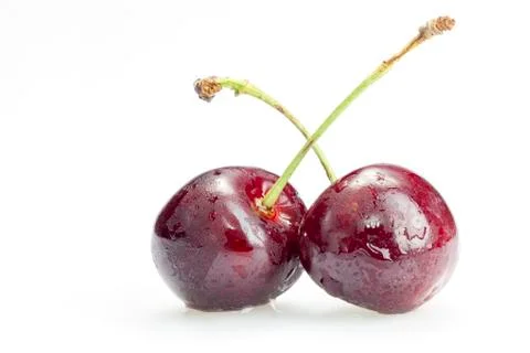 Two cherry berries on white background Stock Photos