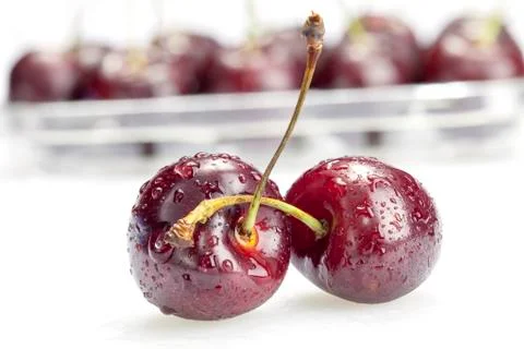 Two cherry berries on white background Stock Photos