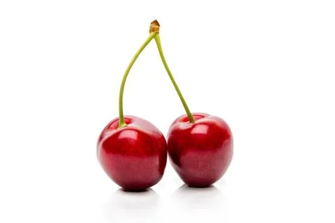 Two Cherry on a peduncle isolated on a white background Stock Photos