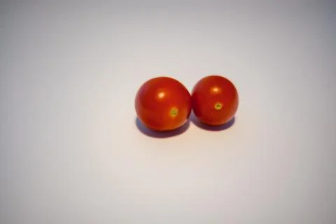 Two cherry tomatoes Stock Photos