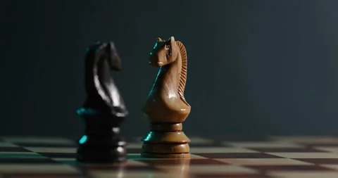 Two Chess knight figures spread on the empty chess board 4K video Stock Footage 131135251