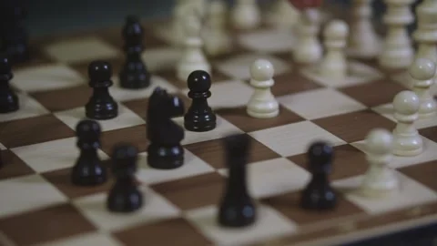 Two chess players play chess, chess pieces are placed on the board Video stock 297586905