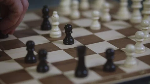 Two chess players play chess, chess pieces are placed on the board Video stock 297587301