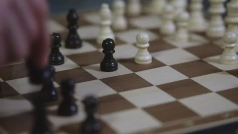 Two chess players play chess, chess pieces are placed on the board Stock Footage 297588604