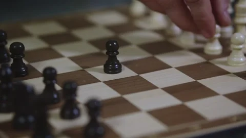 Two chess players play chess, chess pieces are placed on the board Video stock 297590148