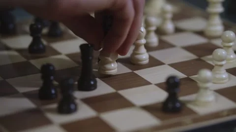 Two chess players play chess, chess pieces are placed on the board Stock Footage 297590196