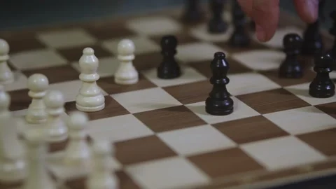 Two chess players play chess, chess pieces are placed on the board Stock Footage 298076302