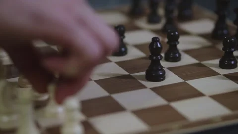 Two chess players play chess, chess pieces are placed on the board Video stock 298076343