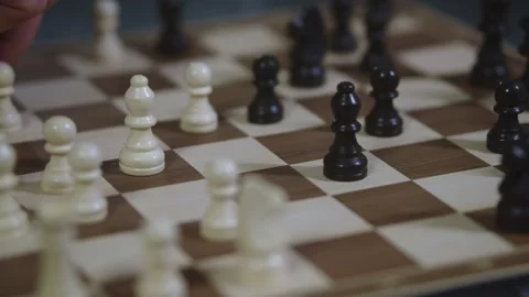 Two chess players play chess, chess pieces are placed on the board Video stock 298077598