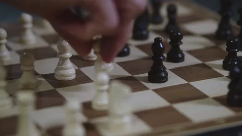 Two chess players play chess, chess pieces are placed on the board Stock Footage 298077655