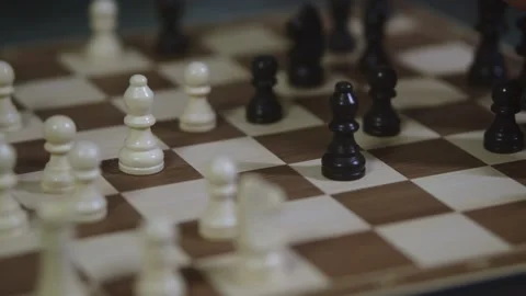 Two chess players play chess, chess pieces are placed on the board Stock Footage 298077682