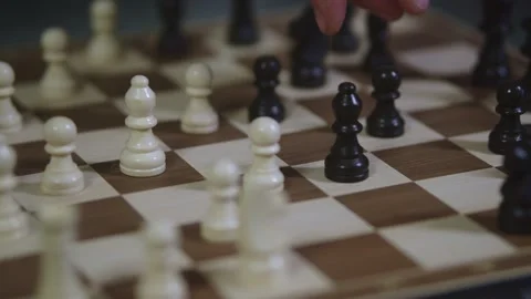 Two chess players play chess, chess pieces are placed on the board Stock Footage 298078822