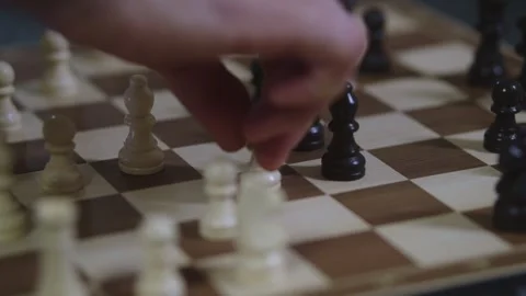 Two chess players play chess, chess pieces are placed on the board Video stock 298079244