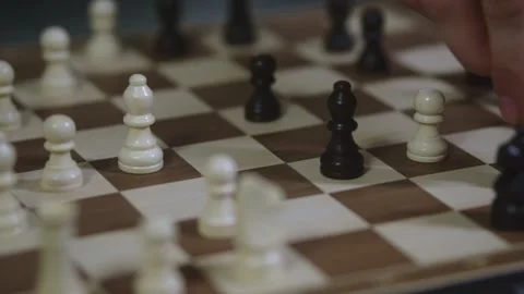 Two chess players play chess, chess pieces are placed on the board Video stock 298080863