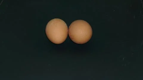 Two chicken eggs of the same size Stock Photos