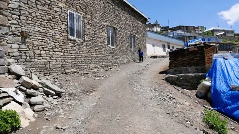 Two child drive bycicle in Khinalig village in Azerbaijan 3 Stock Footage 249171827