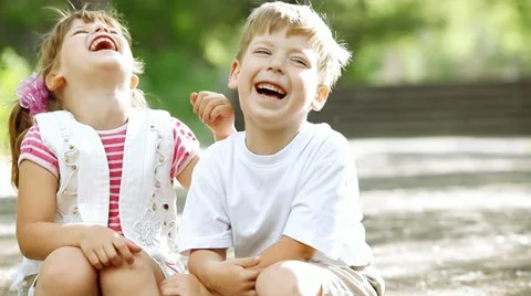 Two child funning in park, outdoors Stock Footage