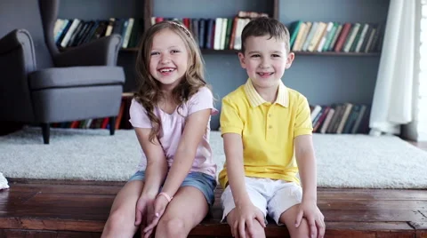 Two child laughing inside the house. indoors Stock Footage 64064610