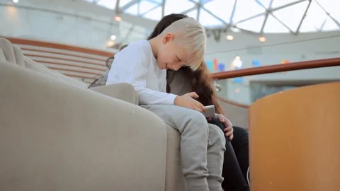 Two child  playing game on smartphone Stock Footage 105884777