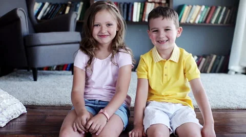 Two child smiling inside the house. indoors Stock Footage 64064149