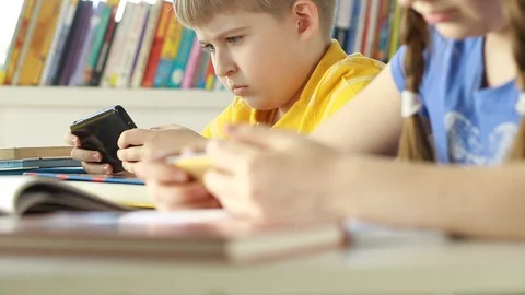 Two child using technology live video call with smartphone.Happy children using  Stock Footage 87611638