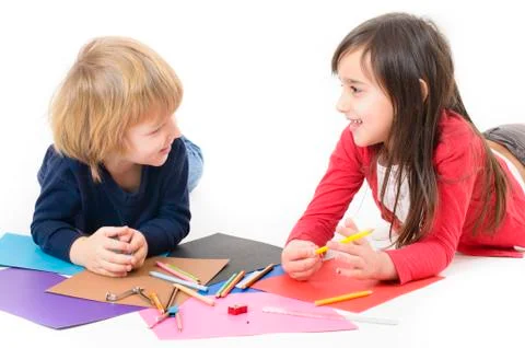 Two children doing homework isolated on white Stock Photos