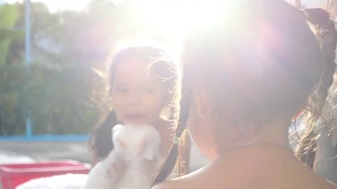 Two children having fun to bath and play with foam in outdoor Stockbeeldmateriaal 79473891