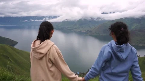 Two children holding hands Stock Footage 302327746