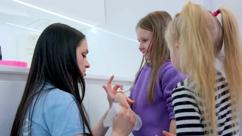 Two children in kindergarten at school in educational institution girl nurse Stock Footage 233962169