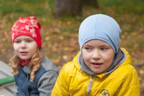Two children in a park in autumn, portrait Stock Photos