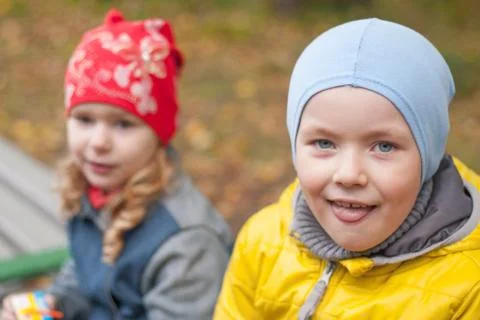 Two children in a park in autumn, portrait Stock Photos