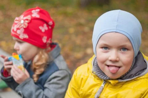 Two children in a park in autumn, portrait Stock Photos