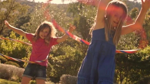 Two children playing with hula hoop in park. Stock Footage 43673339