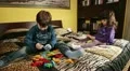 two children playing with puzzles, smiles and fun HD Footage