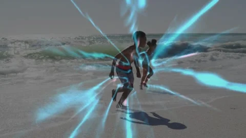 Two children playing at shore, running past camera in surf, radial blue overlay Stock Footage 333830476