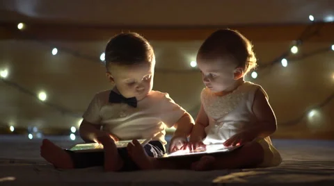 Two children playing with a tablet Stock Footage 60660631