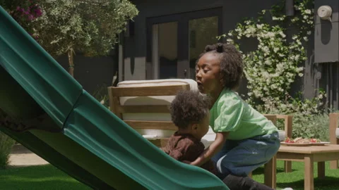 Two Children Playing in Their Backyard Видео 270312446