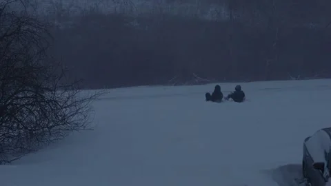 Two children sledding Stock Footage 327902323