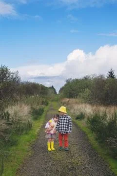 Two children standing on a path Stock Photos