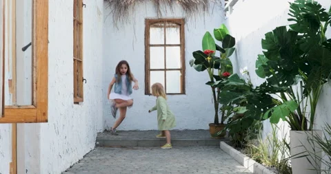 Two childs playing outside Stock Footage 156493095