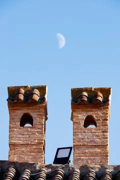 Two chimneys with the moo Stock Photos