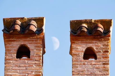 Two chimneys with the moo Stock Photos