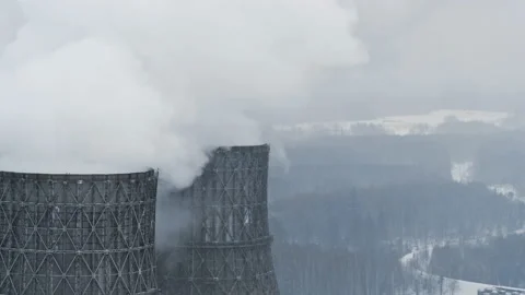 Two chimneys power plant emit smoke or steam into the air. Aerial drone footage Stock Footage 220307631