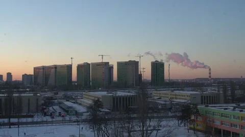 The two chimneys of the power plant give off white puffs of smoke Polluting Stock Footage 284222989