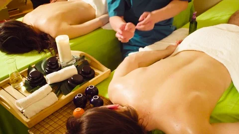 Two chinese therapists doing vacuum massage Video stock 89686184