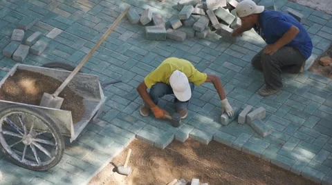 Two Chinese workers maintaining sett Stock Footage 41247546