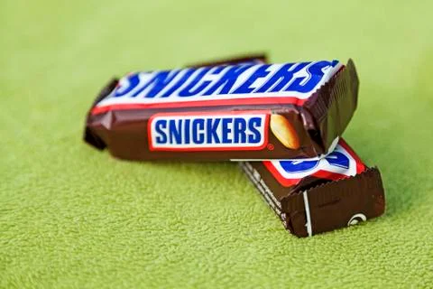 Two chocolate bars on a green background Stock Photos