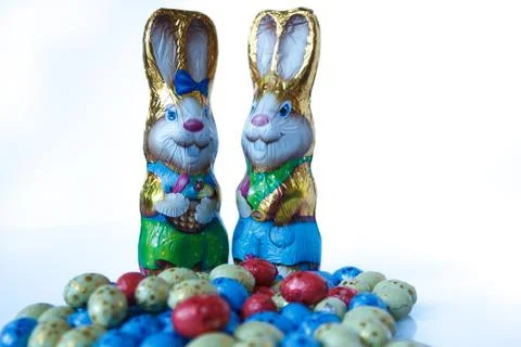 Two chocolate easter bunnies and chocolate easter eggs Stock Photos