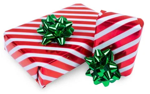 Two christmas gift boxes with red and white stripes and green bows isolated on Stock Photos